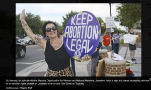 Sue Mendez Waves At Cars With Keep Abortion Legal Sign