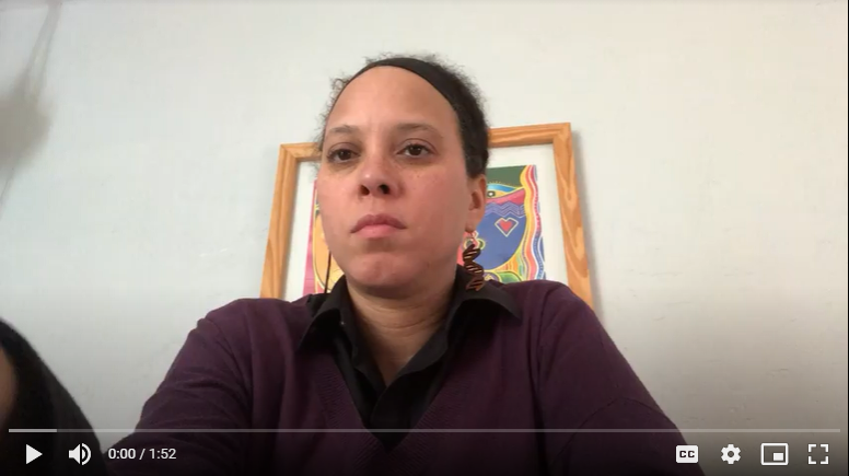Image of woman sitting . Image serves as a link to her video.